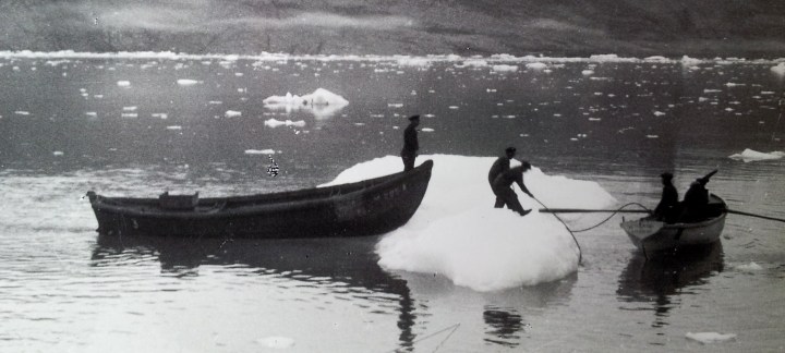 people boat iceberg photo